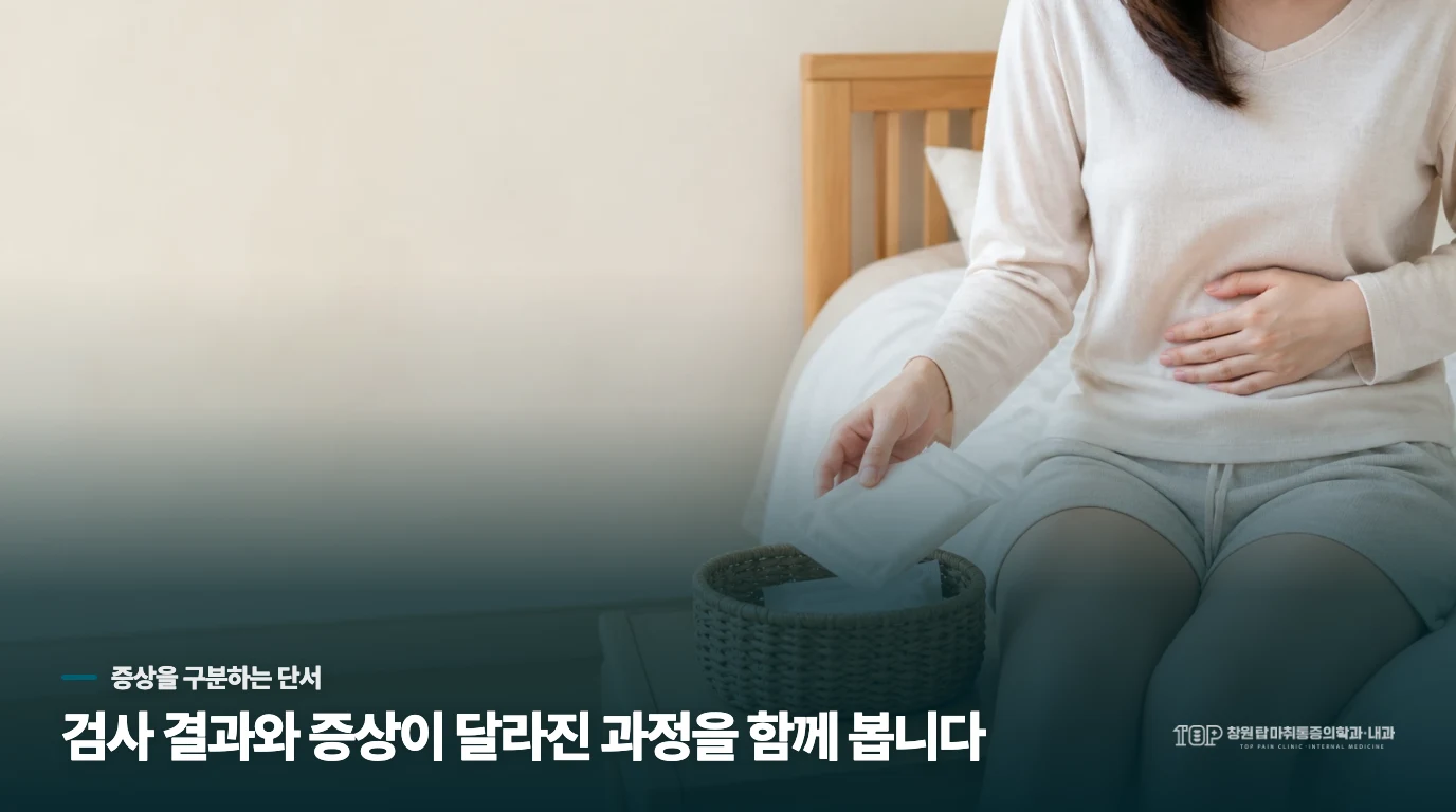 아기 옷을 정리하는 손의 돌봄 장면